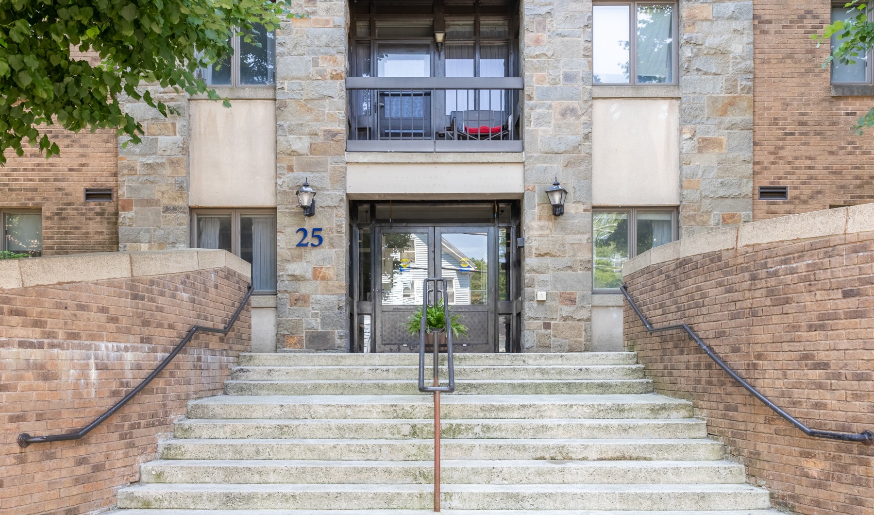 The essence of exceptional living front of a building with a stone staircase and entrance